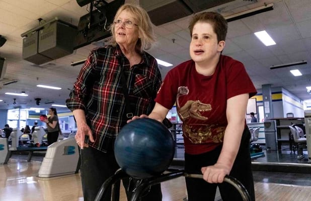 Residents participating in a bowling activity at the facility