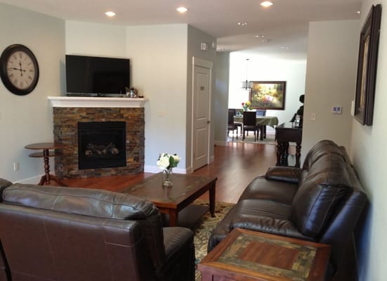 Common area with leather sofas and a fireplace