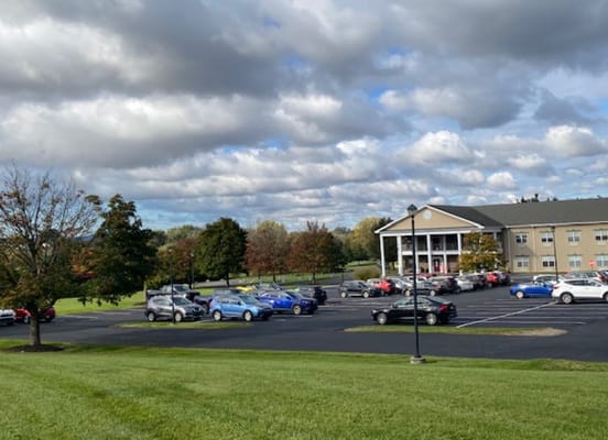 Exterior view of the facility with parked cars
