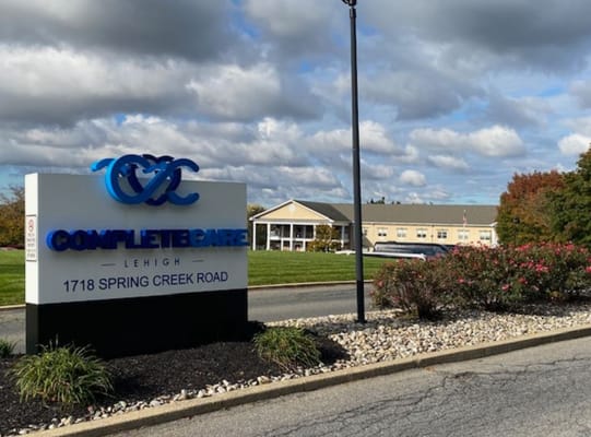 Facility logo at the entrance featuring the name