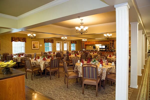 Dining room with tables set for residents