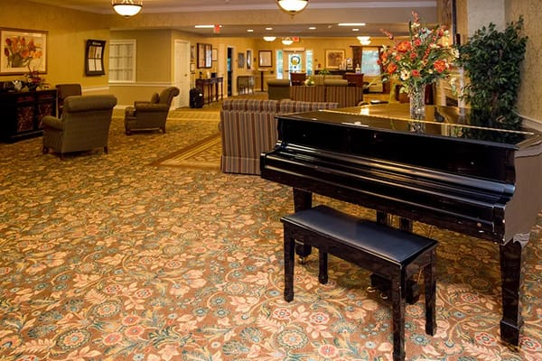 Interior view of a common area with a piano