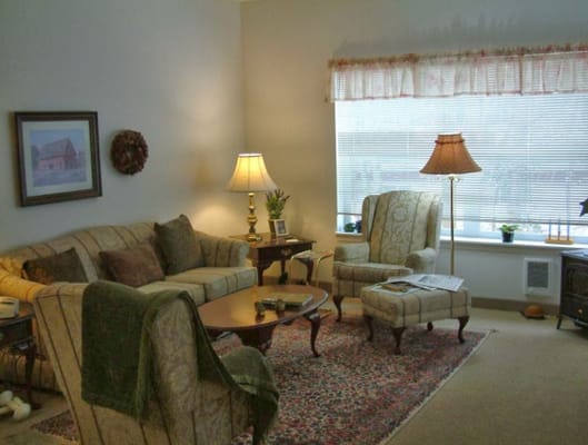 Cozy lounge area with comfortable seating and lamps