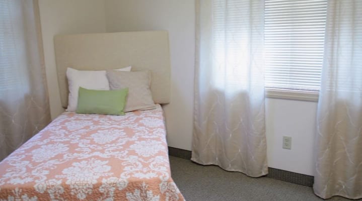 Cozy private resident room with floral bedding