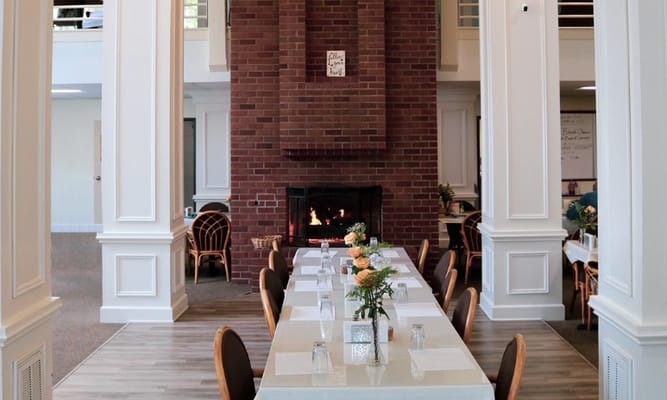 Dining area with a fireplace and elegant table setting