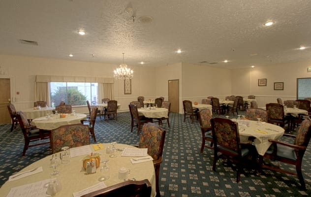 Dining area with tables and floral chairs