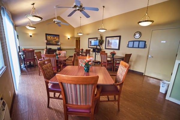 Dining room with tables and floral centerpieces