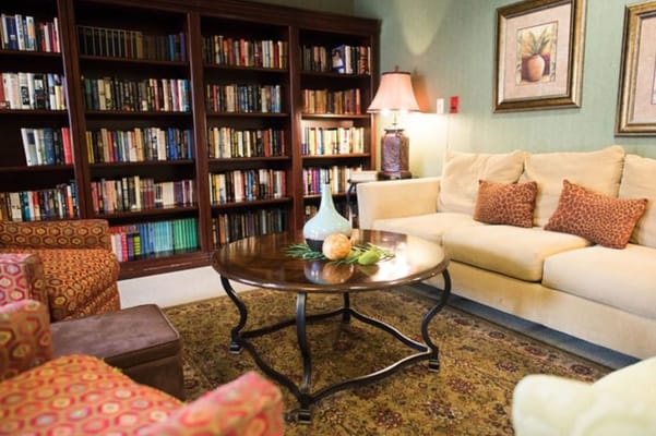 Cozy common area with bookshelves and seating
