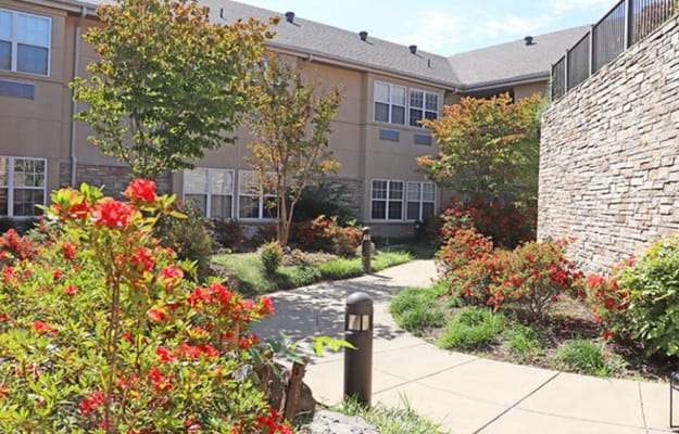 Beautifully landscaped outdoor space with flowers and pathways