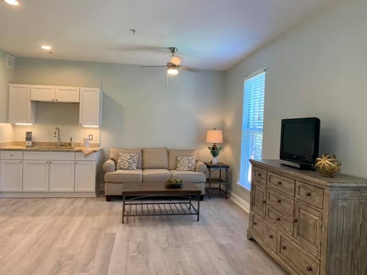 Cozy interior living space with a sofa and kitchenette