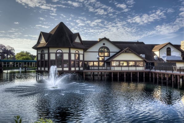 Exterior view of a senior living facility by the water