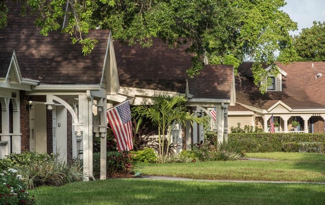 Cottages with flags and greenery in the outdoor area