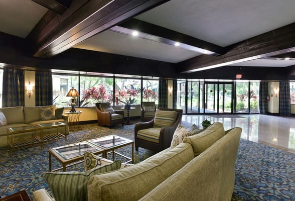 Interior common area with seating and large windows