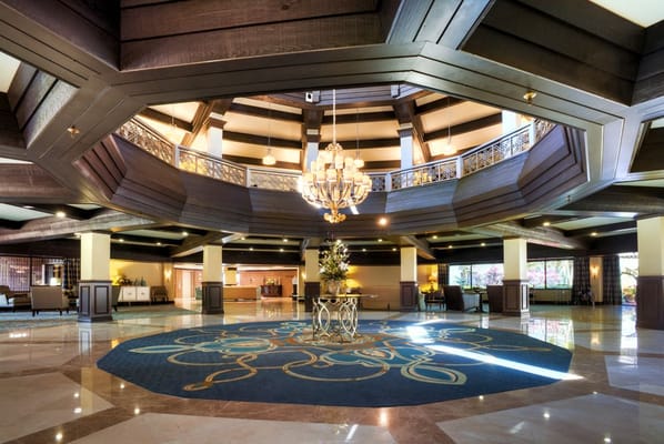 Elegant lobby area with chandelier and seating