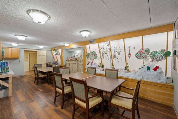 A common area in Halcyon at West Bay featuring festive decorations and tables