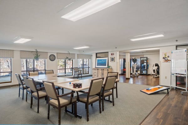Activity room with tables and fitness equipment