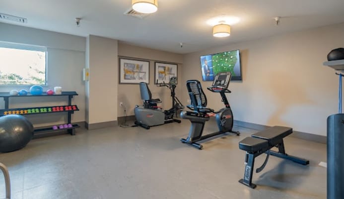 Interior view of a fitness area with exercise equipment