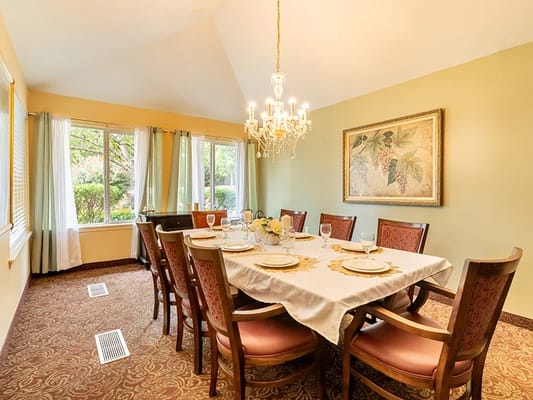 Elegant dining room setup with a chandelier and floral decor