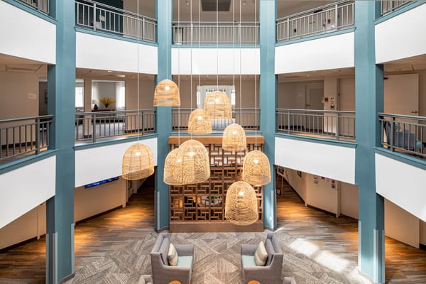 Interior view of a common area with hanging lights