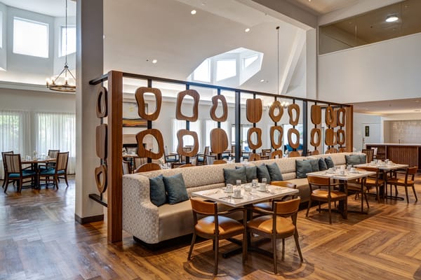 Dining area with elegant seating and decor
