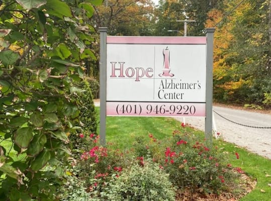 Sign for Hope Alzheimer's Center with floral landscaping