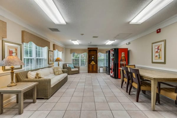 Bright and spacious common area with seating and vending machines