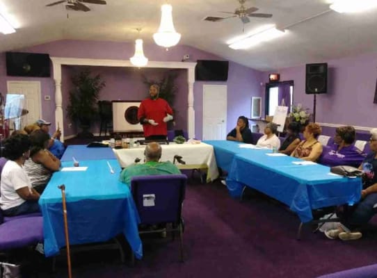 Residents participating in a group activity in a community room
