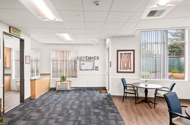Bright common area with a decorative calendar and seating