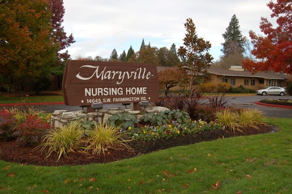 Exterior sign of Maryville Nursing Home with landscaping