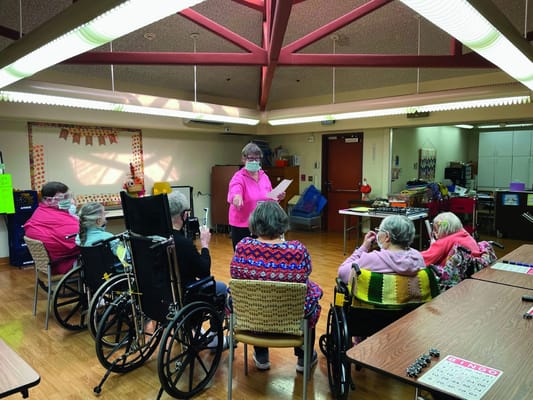 Residents participating in a group activity in a common room