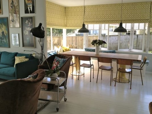 Bright common area with dining table and chairs