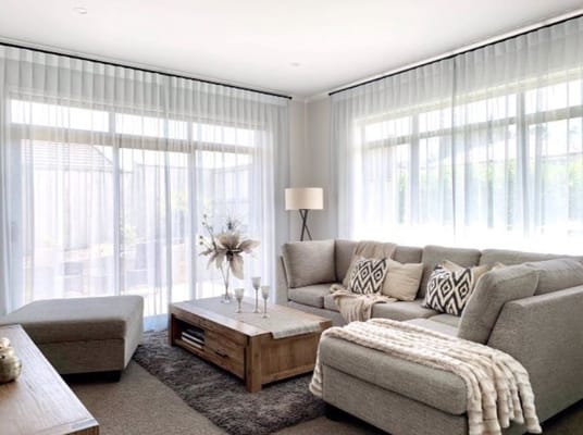 Cozy common area with comfortable seating and natural light