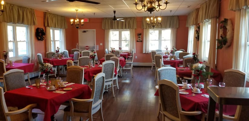 Dining room setup with tables and decorations