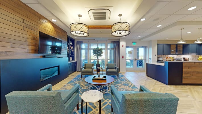 Interior lounge area with modern furniture and large windows