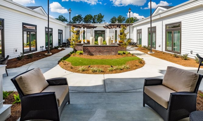 Outdoor courtyard with seating and garden features