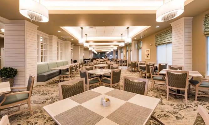 Interior view of a bright dining room with tables