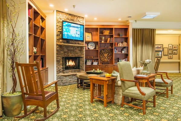 Cozy common area with comfortable seating and a fireplace