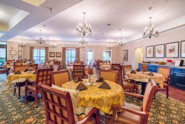 Dining room with elegantly set tables and decor