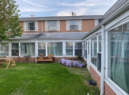 Outdoor view of the facility with gardens and seating