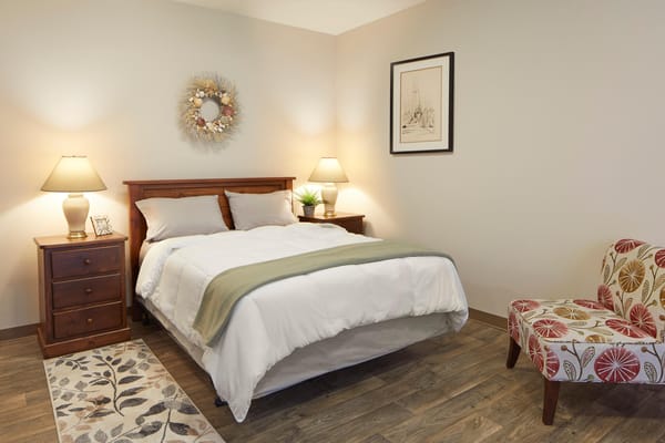 Bright and inviting bedroom in a senior living facility