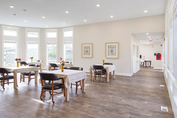 Bright dining room with tables and chairs