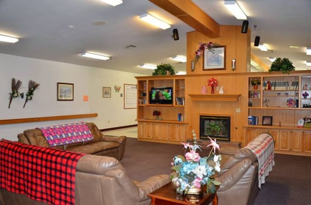 Cozy common area with seating and a fireplace
