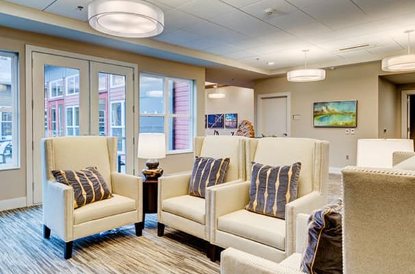 Bright common area with comfortable seating and large windows