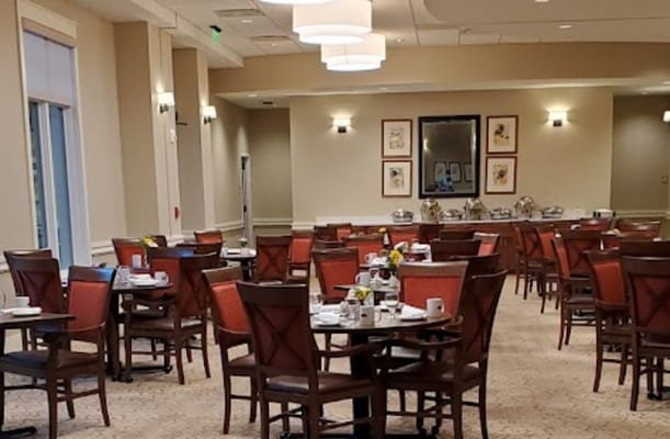 Dining area with tables set for breakfast