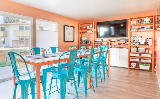 Bright common area with colorful seating and decor