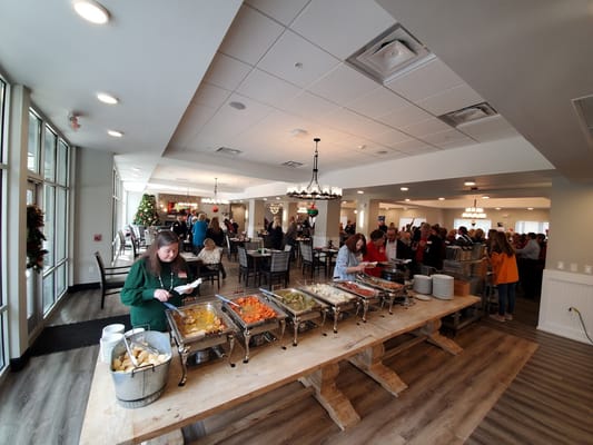 Residents enjoying a buffet meal in a dining area
