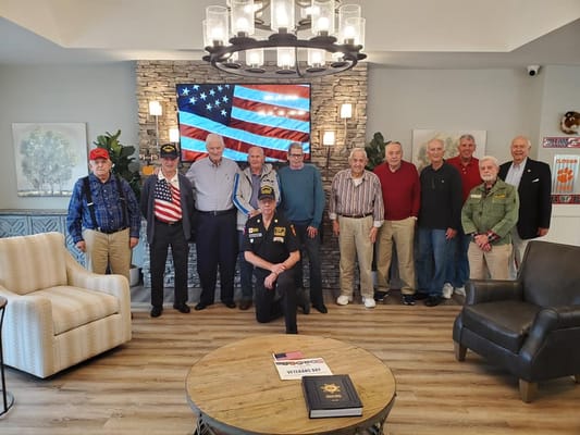 Group of veterans posing in a common area
