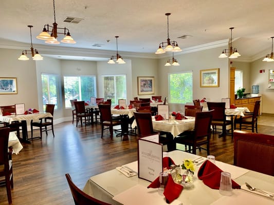 Bright dining room set up for a meal service