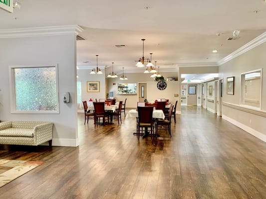 Dining area with tables and chairs in a well-lit room