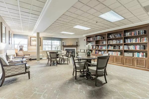 Cozy common area with bookshelves and seating